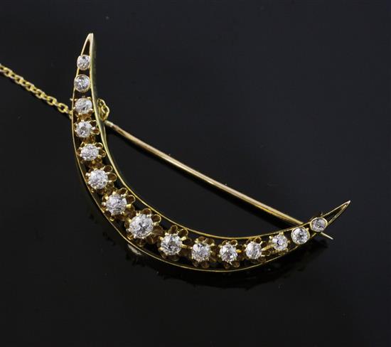 A Victorian style gold and diamond crescent brooch, 1.75in.